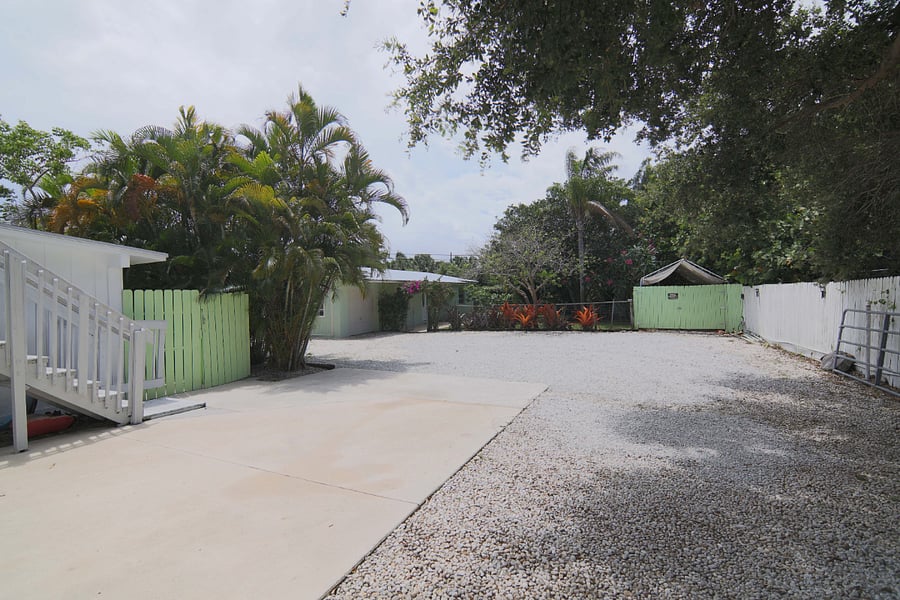 (right side/west side) Driveway back to Property alongside front House