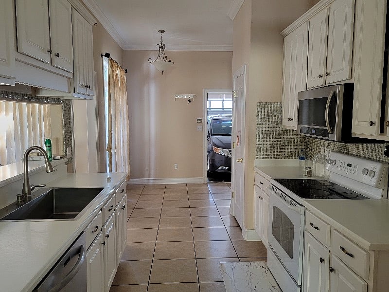 Fully stocked kitchen with microwave, dishwasher, oven, etc