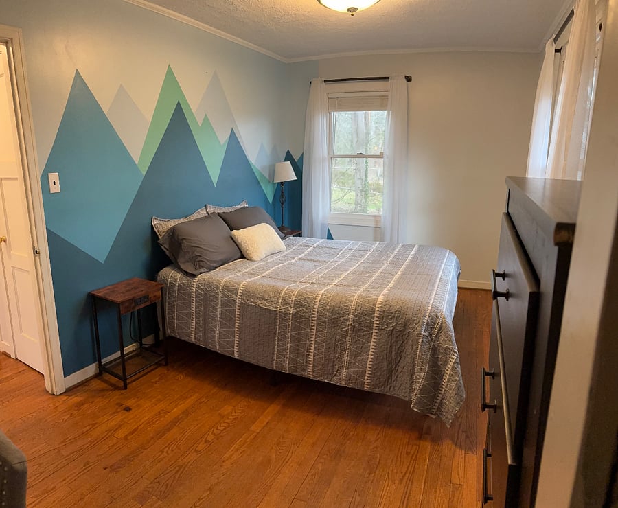 Bedroom #2. Single closet/desk area. Queen bed.