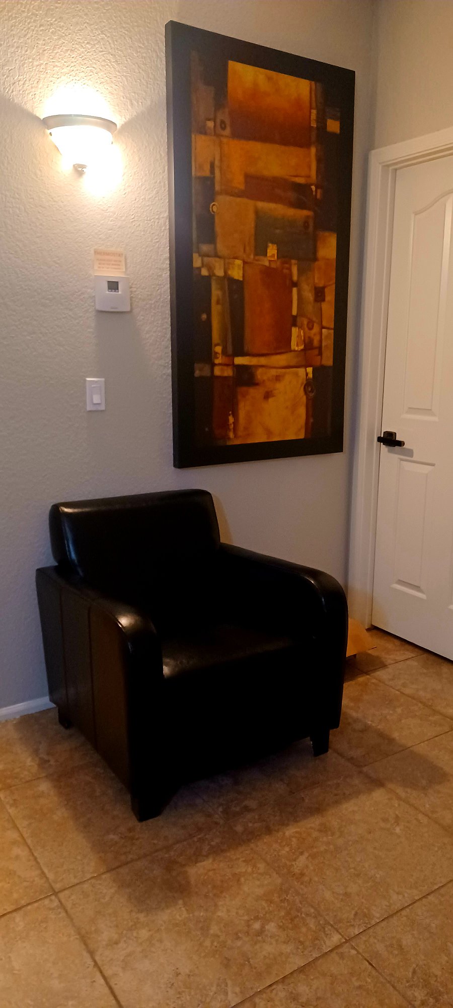 Hall way
comfortable relaxing leather chair
outside bedroom 2 door