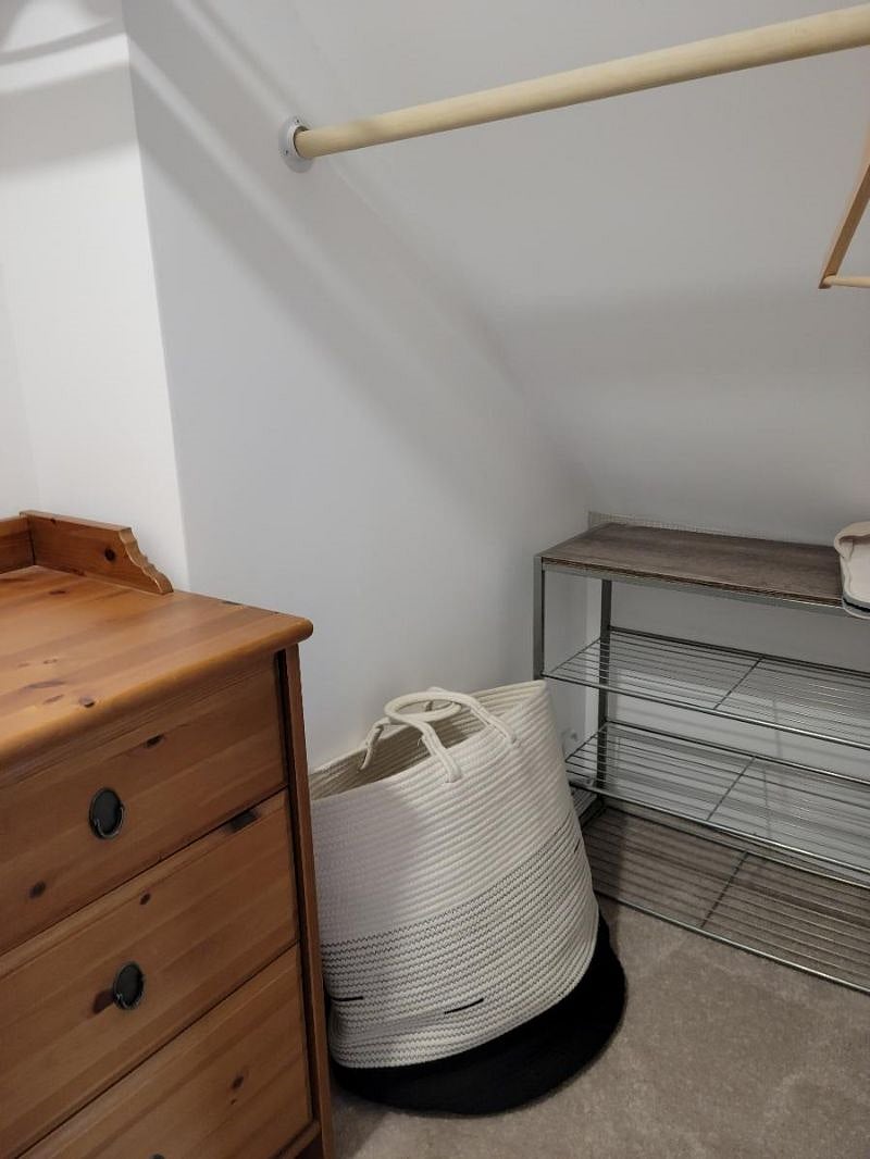 Closet in bedroom for storage. 4-drawer chest-o-drawers is also provided inside closet.