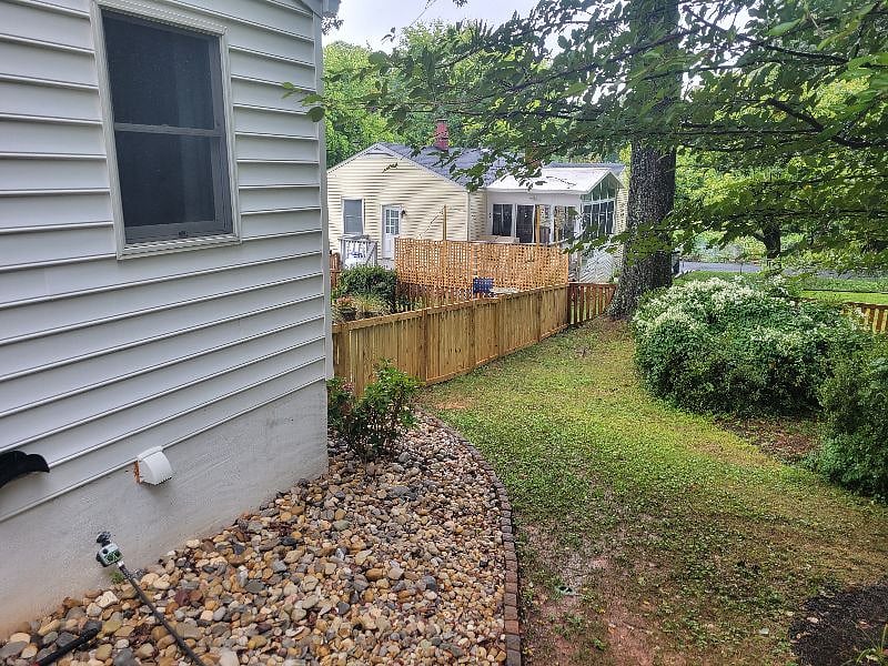 View from backyard of home towards side of house where apartment and courtyard area is located.
