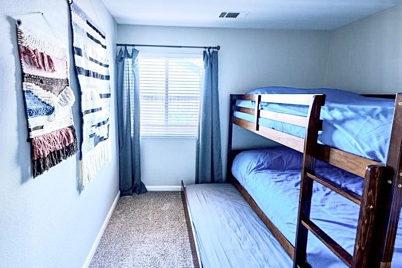 Bunk room plus trundle (2 full sized beds and 1 twin bed)