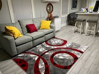 Den area from Bedroom. This custom-made couch has two recliners.