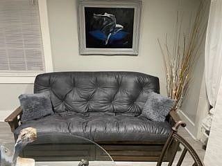 Futon couch that converts to a full-size bed.
