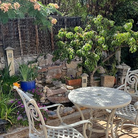 Backyard deck, water garden, dining and seating areas. BBQ available for outdoor cooking if desired.