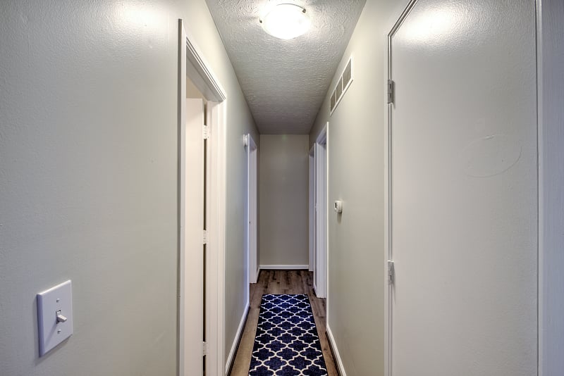 Hallway to bathrooms, bedrooms and office.