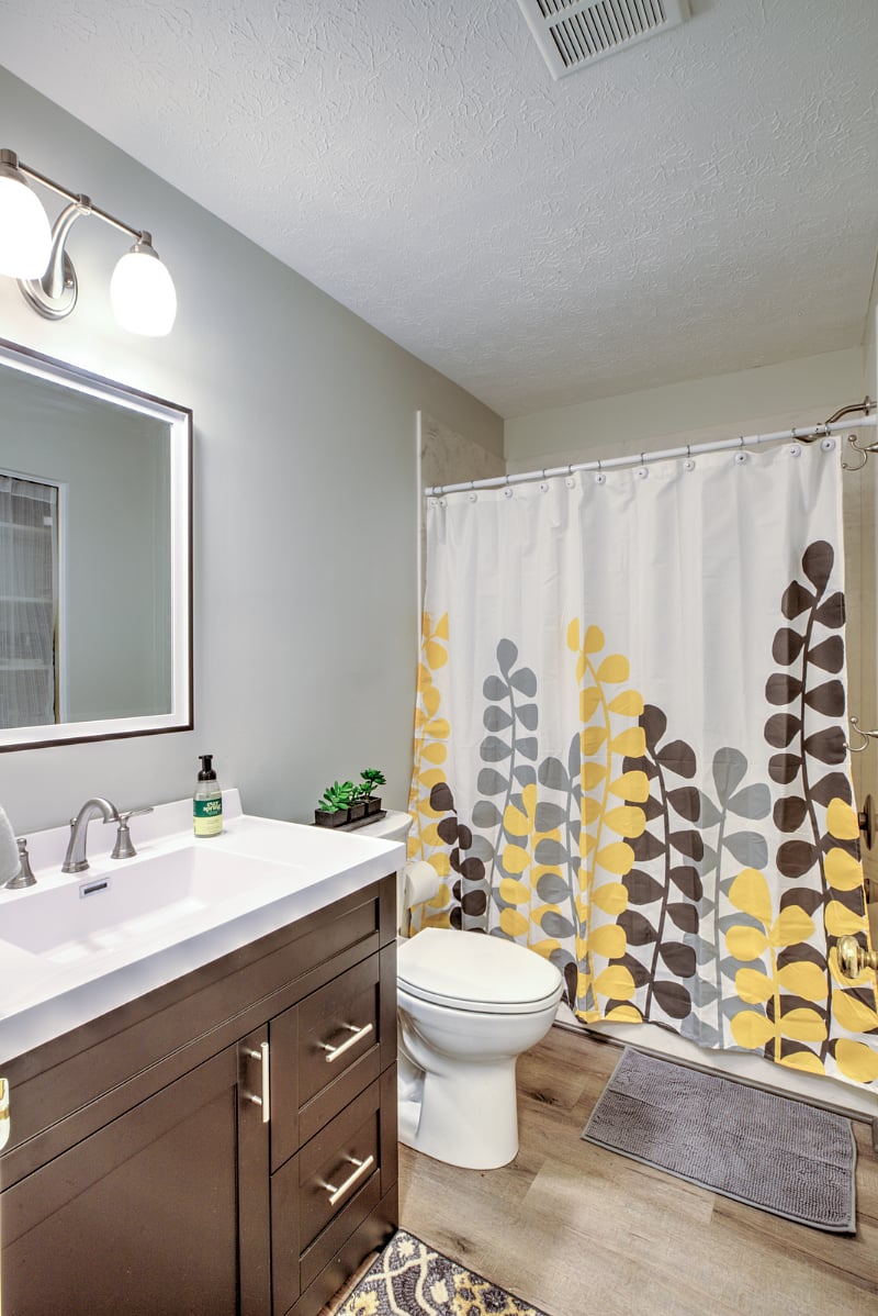 Hall bath fully renovated with double wide closet for storage.