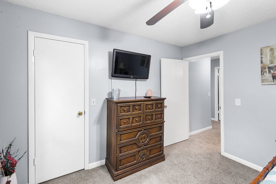 Bedroom for bed with blue comforter
