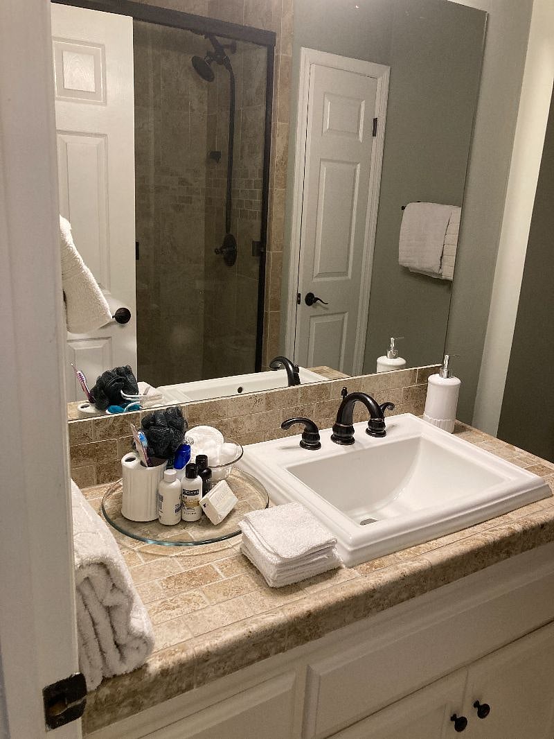 The Master bath features fresh towels, a starter set of soaps, shampoos, a bidet, and walk in shower with fixed and handheld shower heads