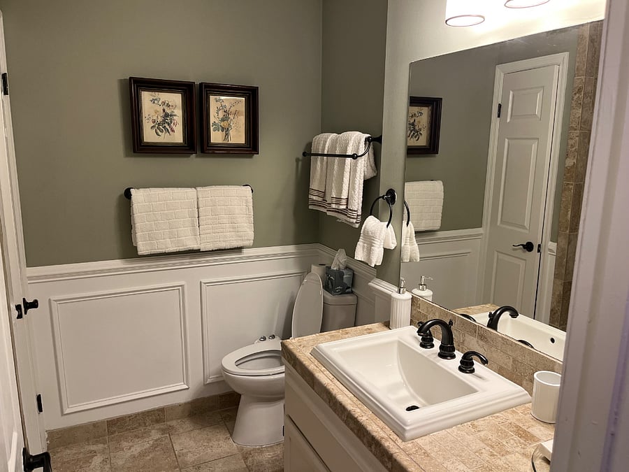 The hall bath features fresh towels, a starter set of soaps, shampoos, a bidet, and a shower / tub combo with fixed and handheld shower heads