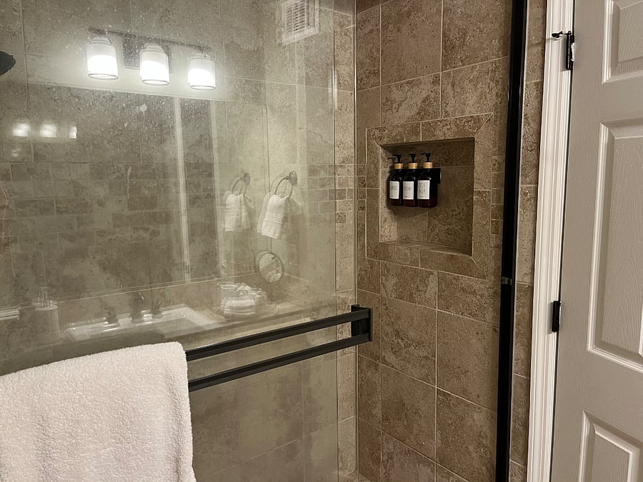 The Master bath features fresh towels, a starter set of soaps, shampoos, a bidet, and walk in shower with fixed and handheld shower heads