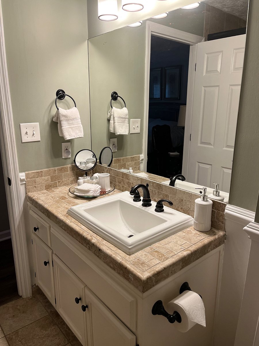 The Master bath features fresh towels, a starter set of soaps, shampoos, a bidet, and walk in shower with fixed and handheld shower heads.