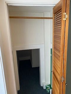 Deep closet adjacent to front door.