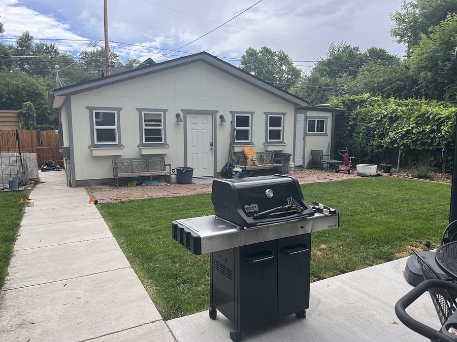 LP grill and view of detached garage from home's back door