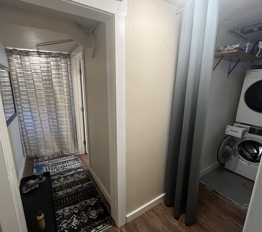 view of of laundry and bathroom entrance from apartment door