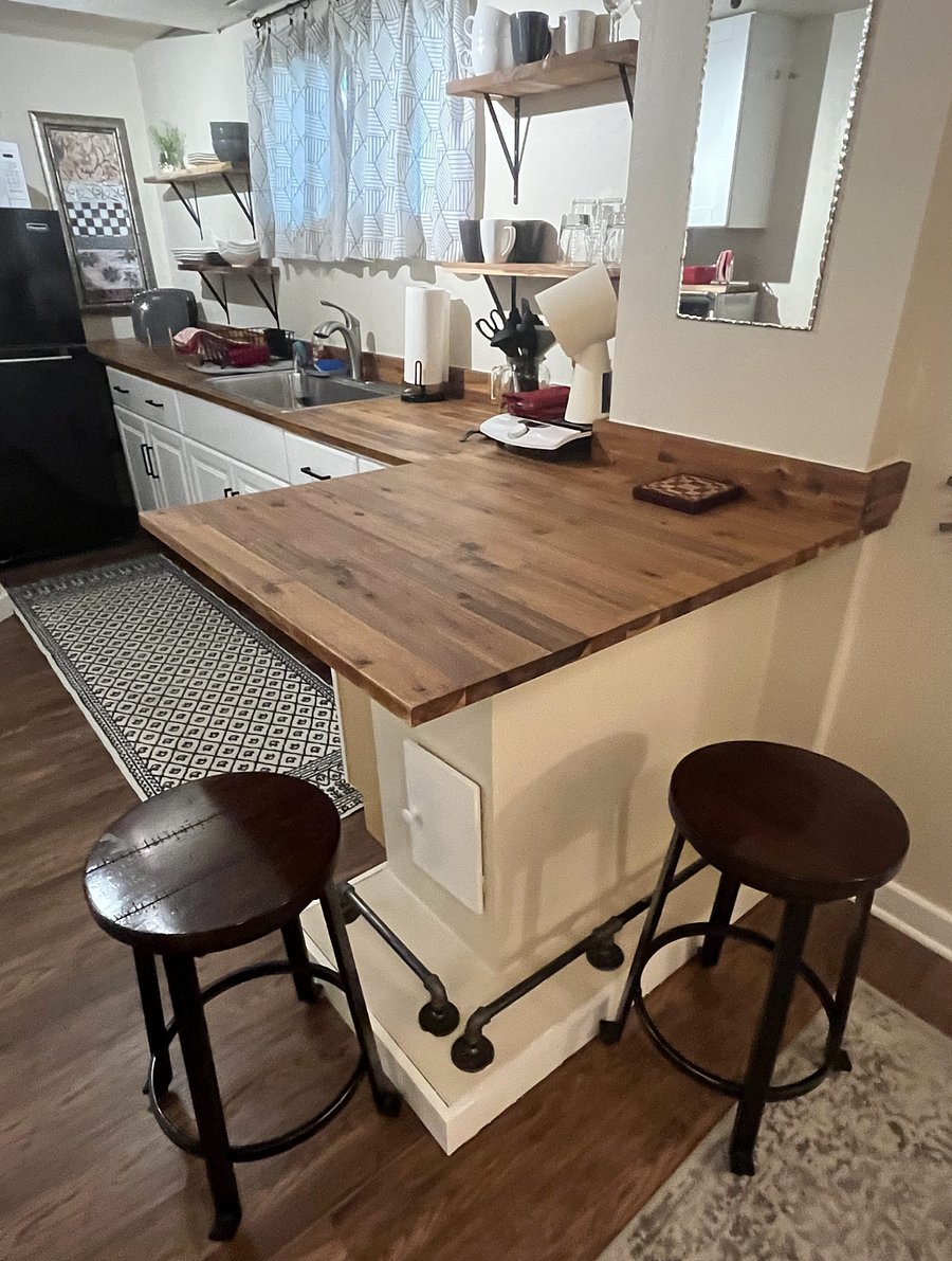 counter height peninsula with seating for two
