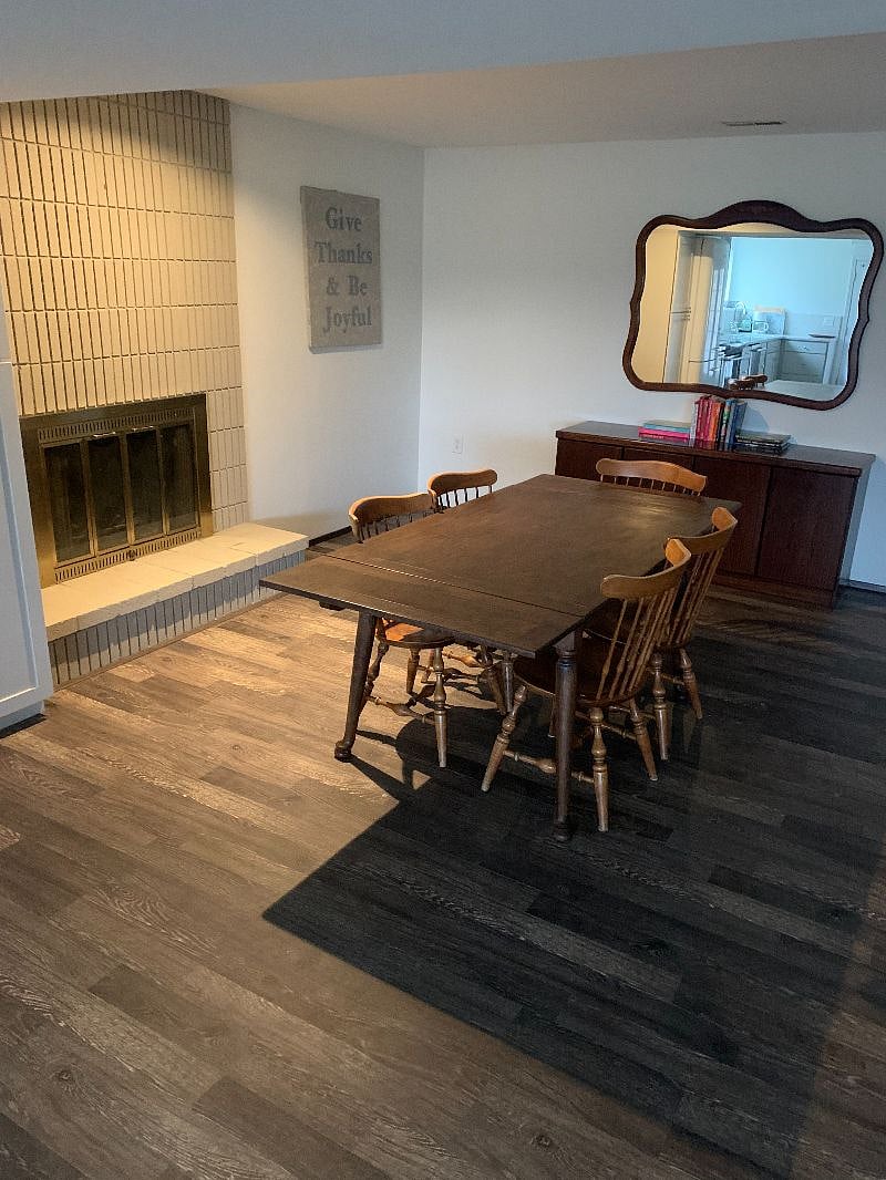 Large dining table for studying or to dine - in. Array of books available to borrow.
