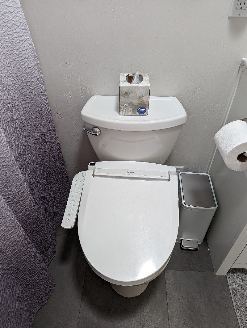 Heated toilet seat with bidet.