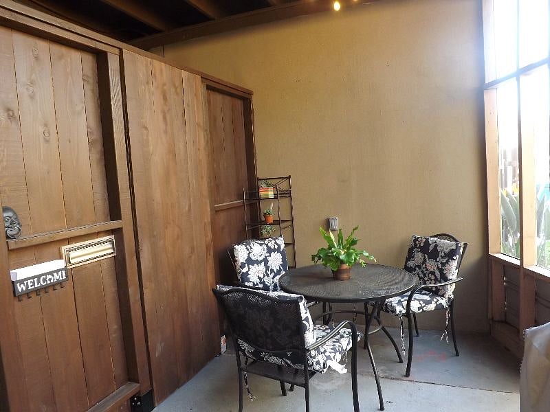 Outdoor seated area (covered/screened patio) with a power source so you can enjoy your morning coffee while using a laptop.