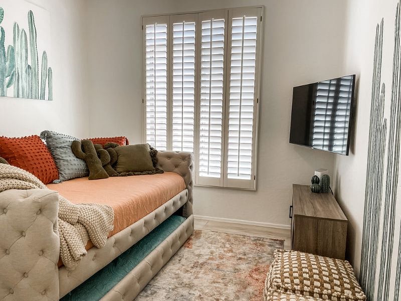 Third bedroom features queen bed and twin trundle below. Full closet with shelves and hang bars.