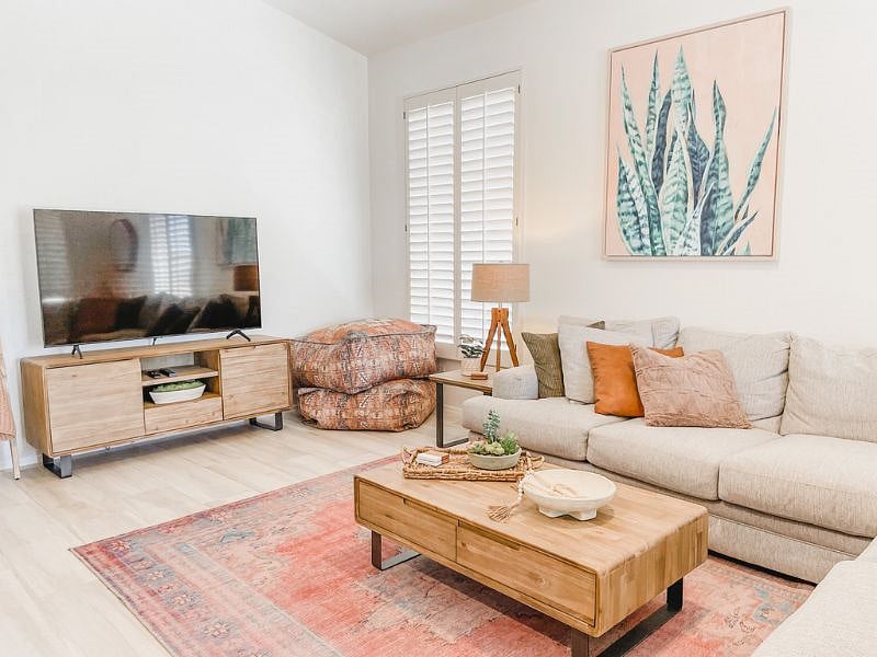 Living room 65" TV equipped with cable and streaming services.