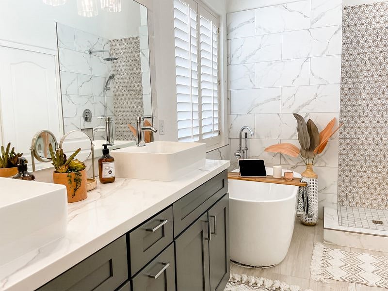 Updated primary en suite bathroom features 5 piece bathroom amenities.