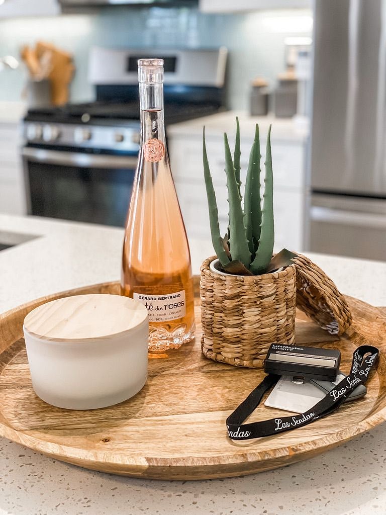 Welcome gift, house information, garage remote and communities amenities key card.