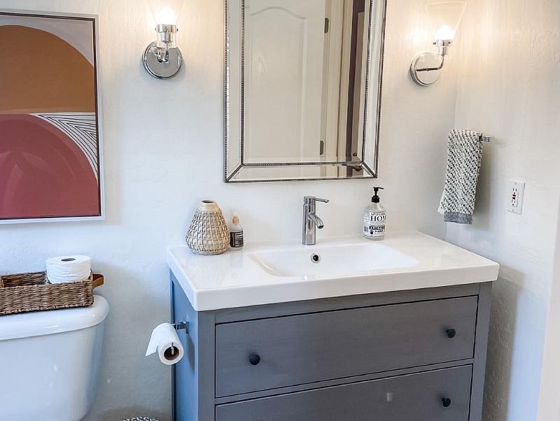 Storage below sink. This bathroom is shared with 2nd door leading to the hallway