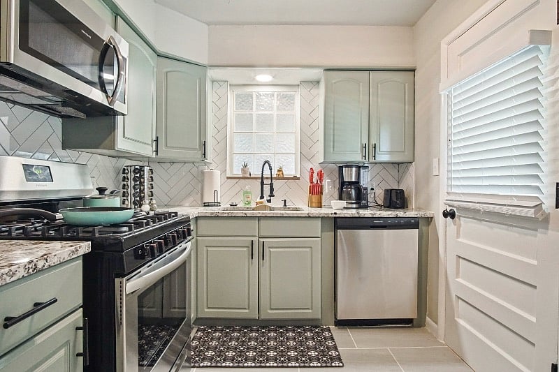 Full kitchen with full size fridge.