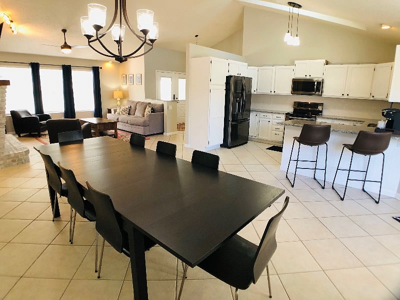 Open-concept dining area connecting the kitchen and living room