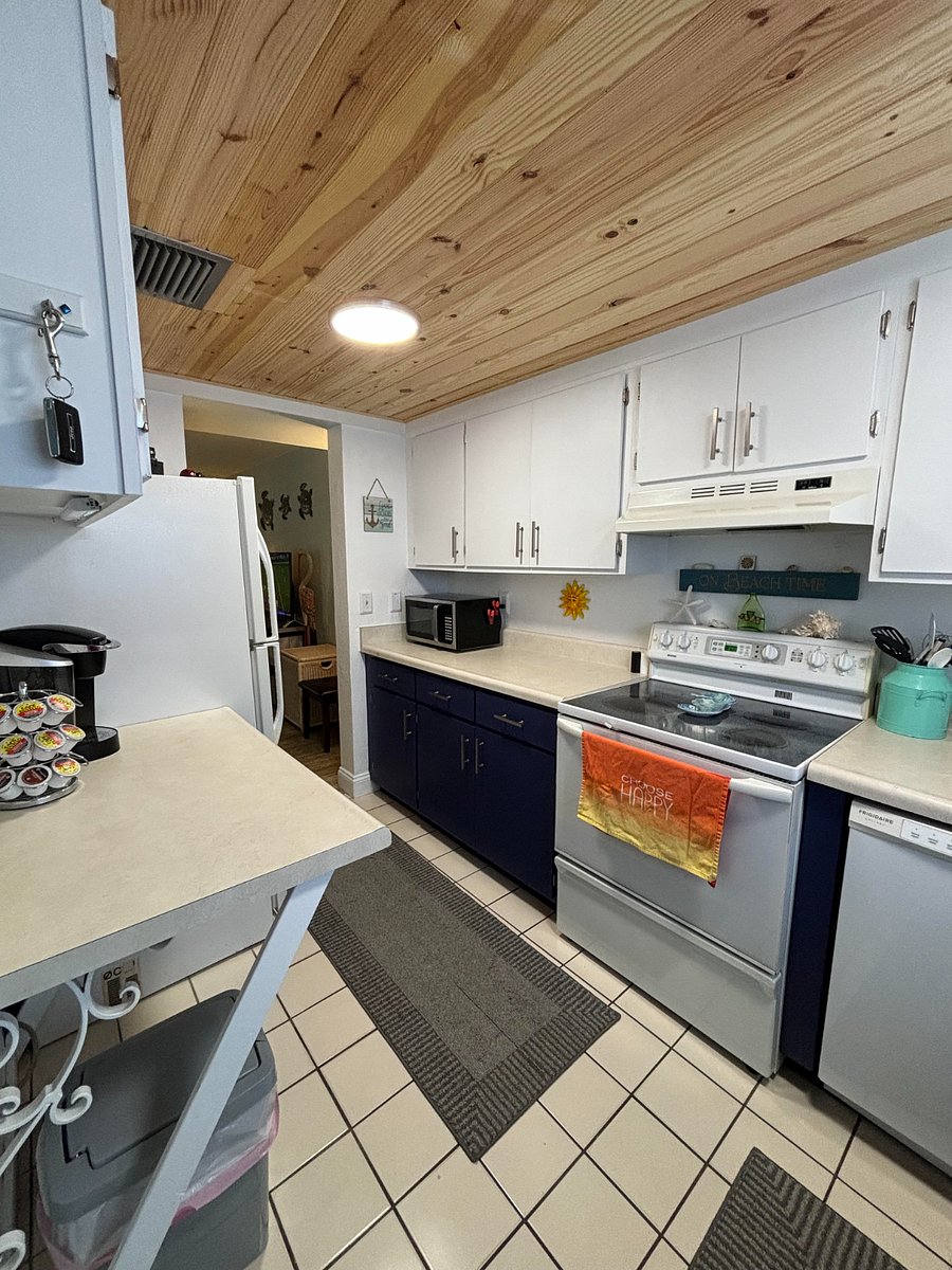 Kitchen- fully stocked with oven, dishwasher, microwave, refrigerator, and Keurig coffee maker, everything needed to just eat at home.
