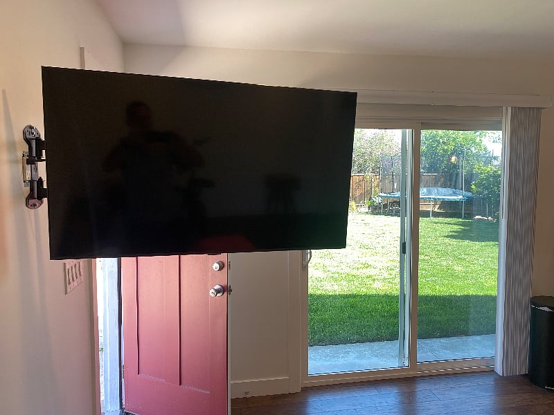 New LED TV on pivot hinge, so can watch with feet up on couch in bed ... or in kitchen while cooking.
