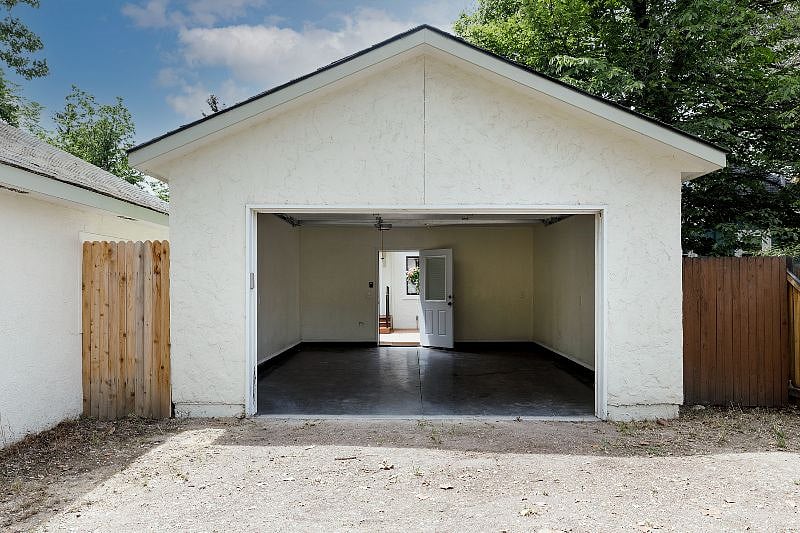 Oversized one-car garage and off-street parking in the alley. Additional storage space available in the adjacent outbuilding.
