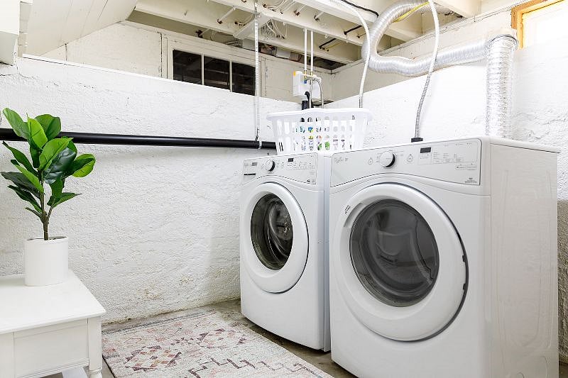 Full-size washer and dryer in basement