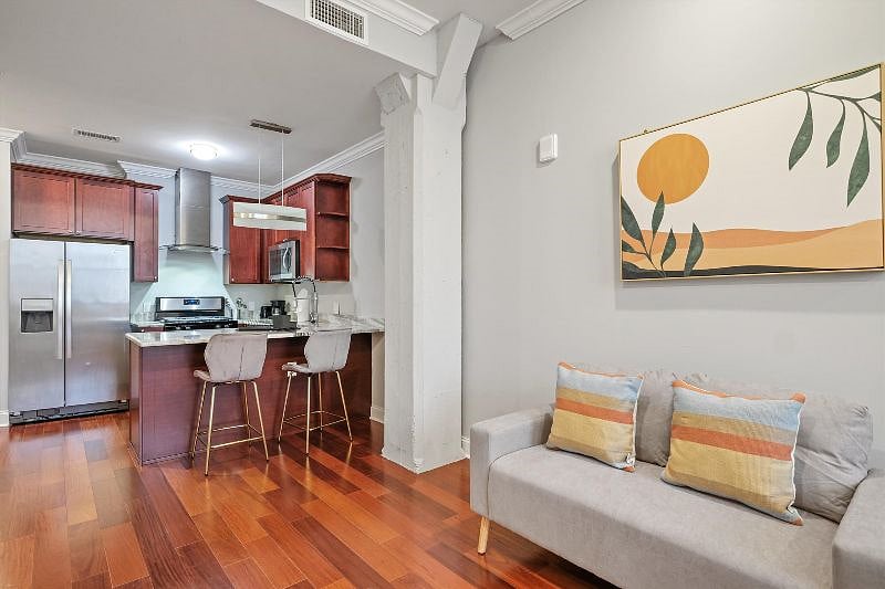 This thoughtfully designed open-concept layout seamlessly connects the living, dining, and kitchen areas, creating a harmonious flow filled with natural light and modern charm. It's a space made for effortless living, entertaining, and everyday comfort.