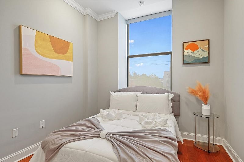 This serene and spacious bedroom offers a perfect retreat, with soft textures, calming tones, and an airy layout that invites rest and relaxation. Designed with both comfort and style in mind, its a peaceful escape from the everyday.