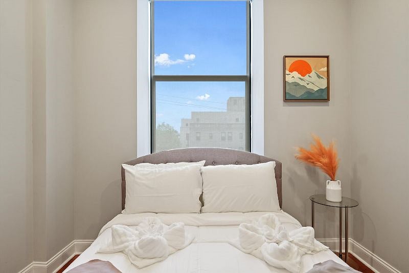 This serene and spacious bedroom offers a perfect retreat, with soft textures, calming tones, and an airy layout that invites rest and relaxation. Designed with both comfort and style in mind, its a peaceful escape from the everyday.