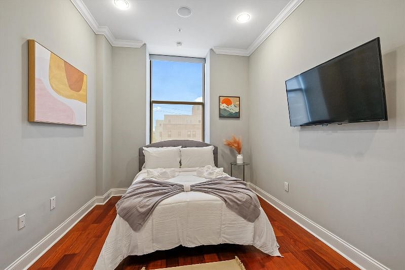 This serene and spacious bedroom offers a perfect retreat, with soft textures, calming tones, and an airy layout that invites rest and relaxation. Designed with both comfort and style in mind, its a peaceful escape from the everyday.