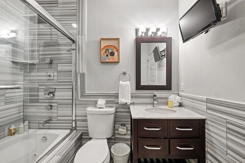 This elegant, spa-inspired bathroom blends clean lines with natural light, creating a calming atmosphere of luxury and simplicity. With spacious design and thoughtful finishes, it's a sanctuary for unwinding and refreshing.