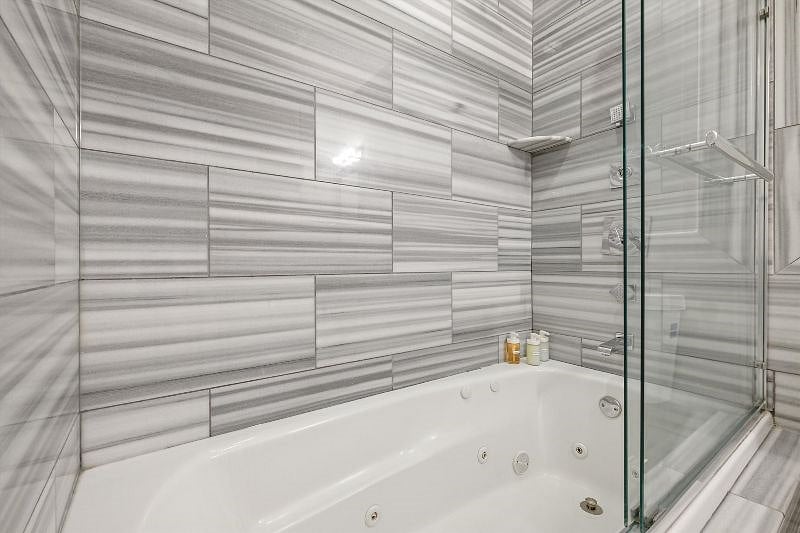This elegant, spa-inspired bathroom blends clean lines with natural light, creating a calming atmosphere of luxury and simplicity. With spacious design and thoughtful finishes, it's a sanctuary for unwinding and refreshing.