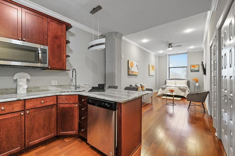This thoughtfully designed open-concept layout seamlessly connects the living, dining, and kitchen areas, creating a harmonious flow filled with natural light and modern charm. It's a space made for effortless living, entertaining, and everyday comfort.