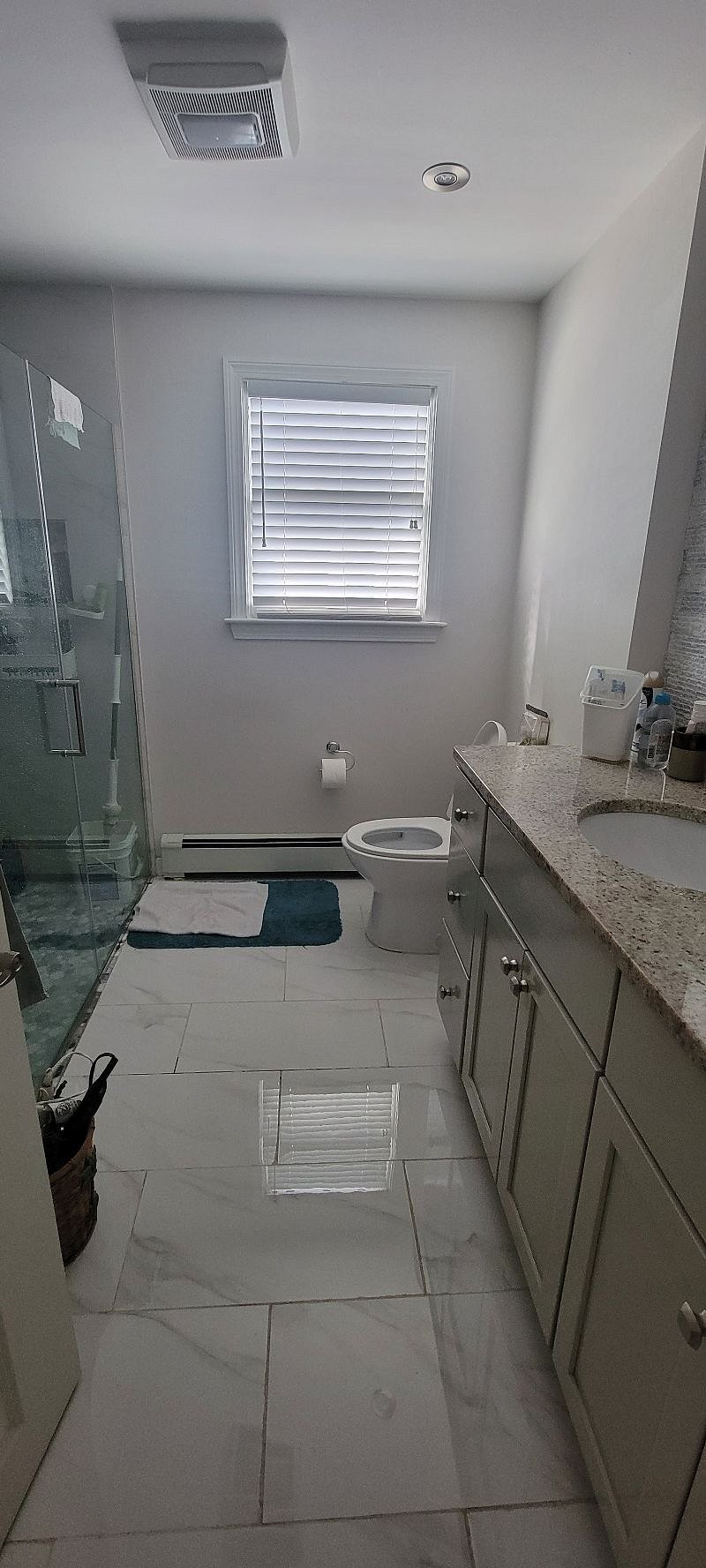 Private bathroom on the side of the room