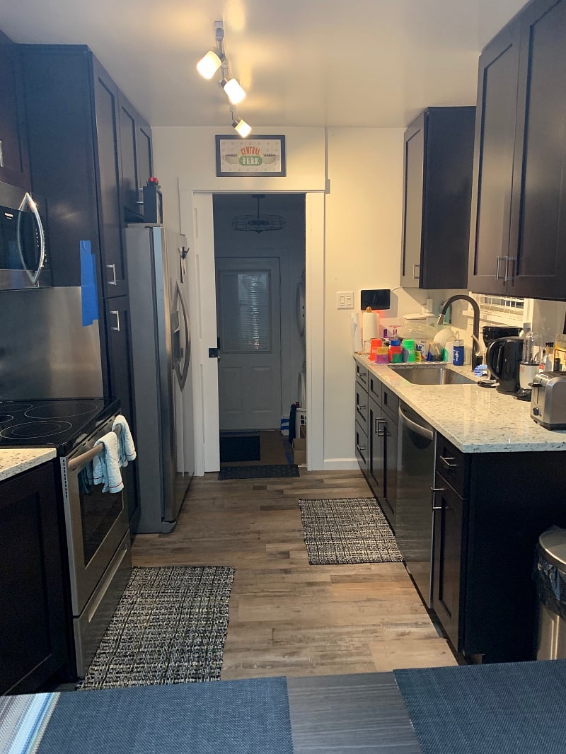 Kitchen with stainless steel appliances, granite countertops, dishwasher, farm sink, utensils, toaster, conventional oven, coffee maker, garbage disposal & 4 top kitchen table