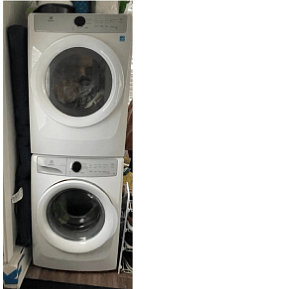 New washer and dryer in laundry room with new utility sink