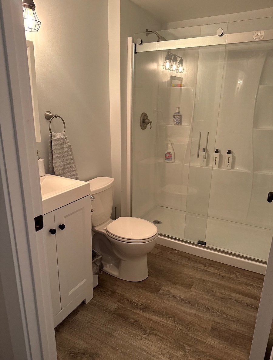 Newly remodeled walk in shower with Bluetooth speaker fan