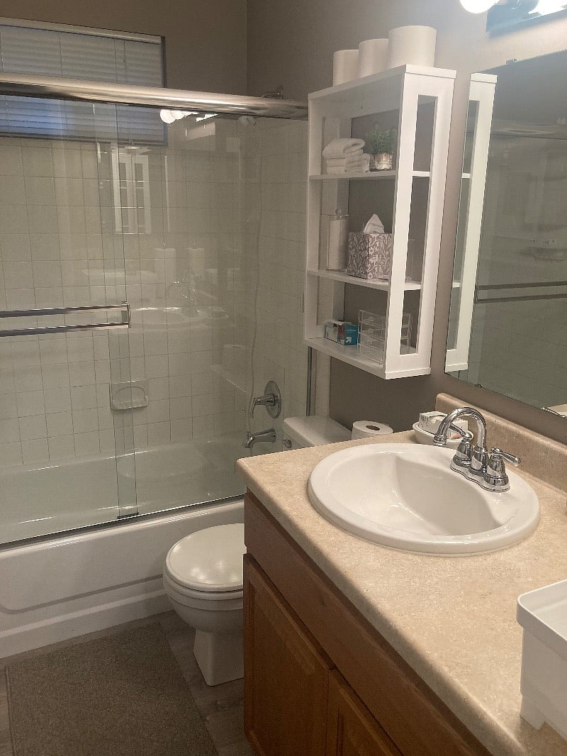 Renter's private bathroom. Extra shelving for incidentals.