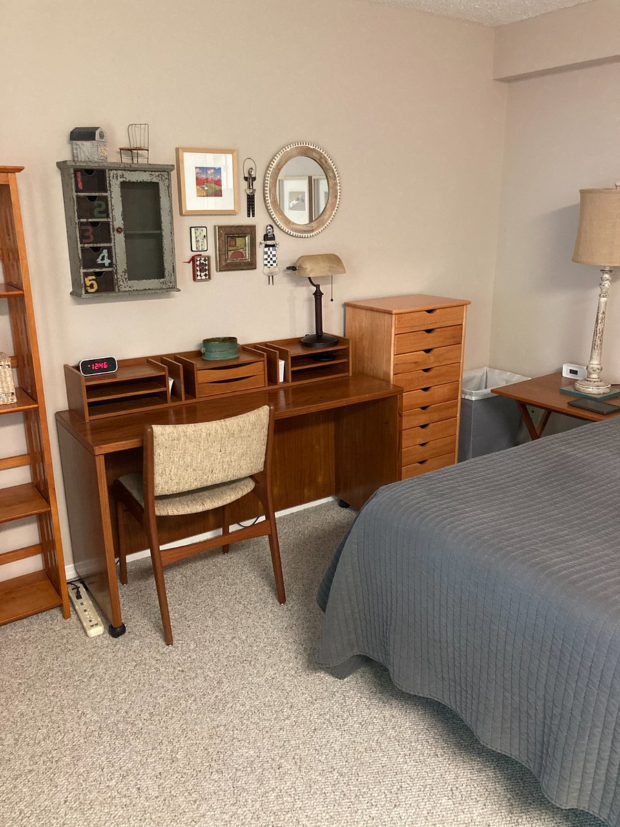 Desk. Chest of drawers for clothes, etc. Can put hamper in corner as shown. Room for suitcases under desktop.