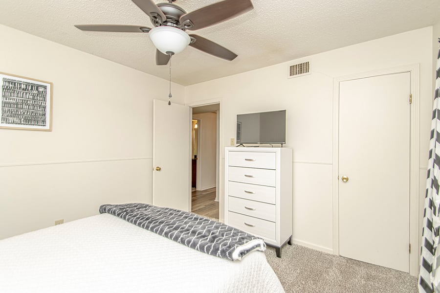 Queen Bedroom with dresser and tv.