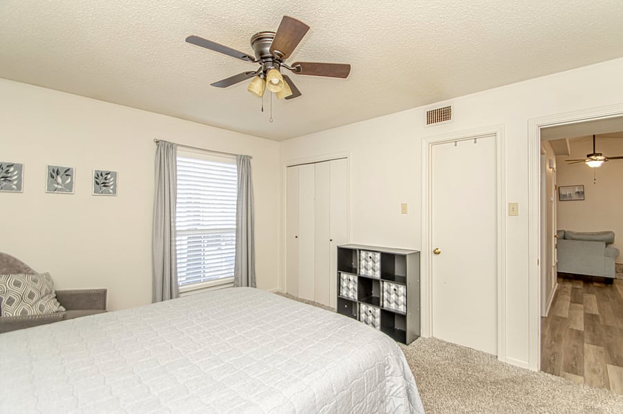 Queen Bedroom with dresser and tv.